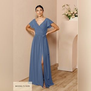 Revelry Harper Chiffon Wrap Dress in ‘Dusty Blue’ color.